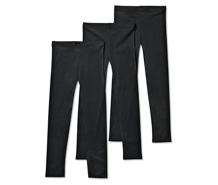 Trois leggings noirs sont disposés côte à côte.