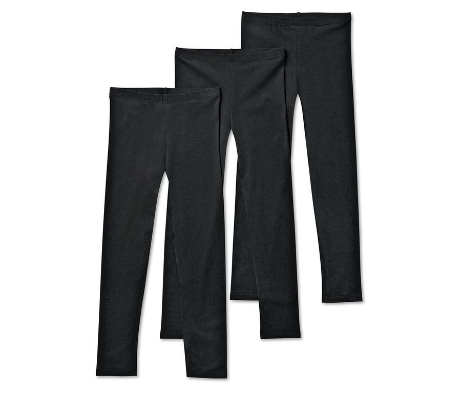 Trois leggings noirs sont disposés côte à côte.