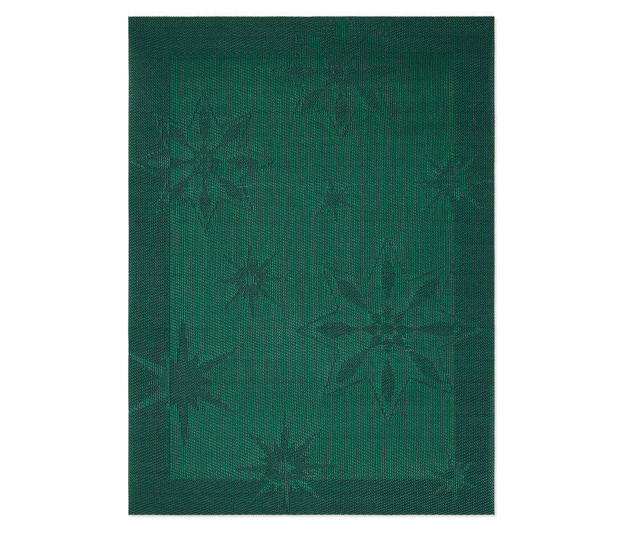 Gros plan sur un set de table en tissu vert avec un motif d'étoiles.