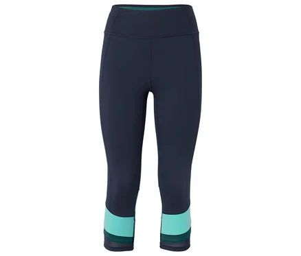 Un legging trois-quarts bleu marine avec un bloc turquoise au bout de la jambe.