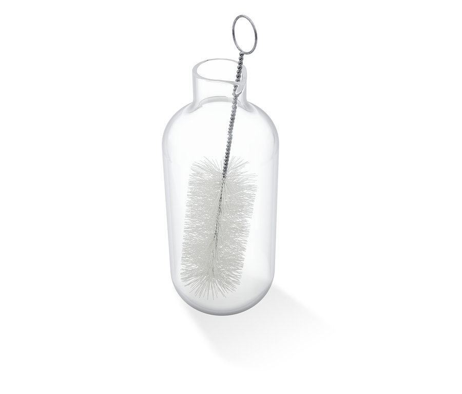 Une brosse de nettoyage est placée dans la carafe à lait pour Esperto Pro & Esperto2 Milk.