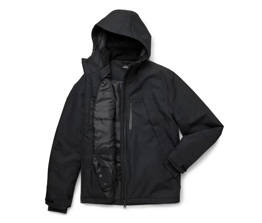 Veste noire à capuche, partiellement ouverte, révélant une doublure intérieure matelassée et une poche poitrine verticale zippée.