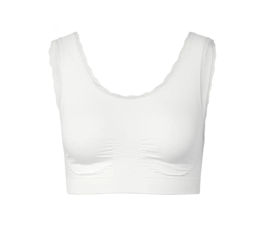 Bustier blanc avec détails en dentelle à l'encolure et aux emmanchures.