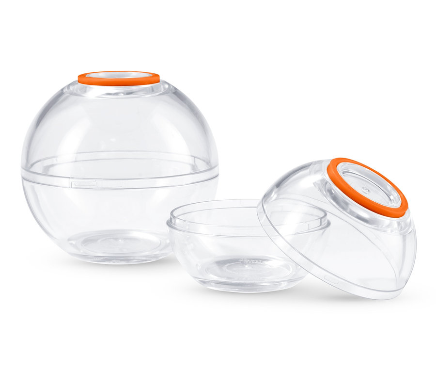 Deux boules de conservation avec des couvercles orange.