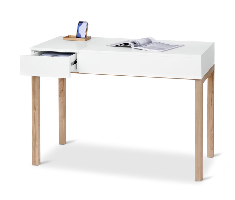 Bureau blanc avec pieds en bois, tiroir ouvert, téléphone et magazine. Bureau-console, avec plateau relevable.