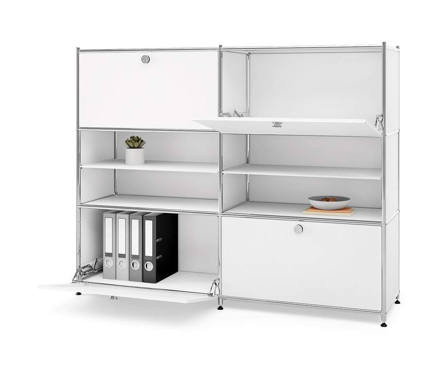 Commode en métal blanche « CN3 » avec 4 abattants, dont certains sont ouverts. Sur les étagères, il y a une plante en pot, un bol et des classeurs.