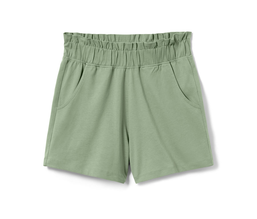 Shorts en jersey vert pour enfant avec taille élastique et poches.