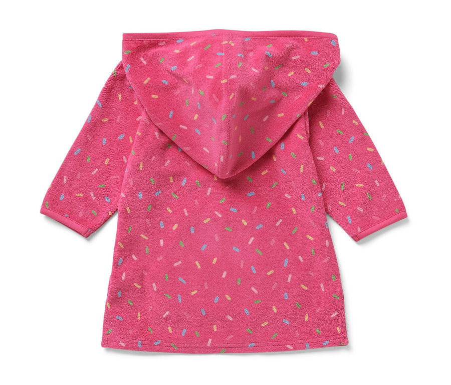 Poncho rose en tissu éponge pour enfant avec capuche et décorations colorées.