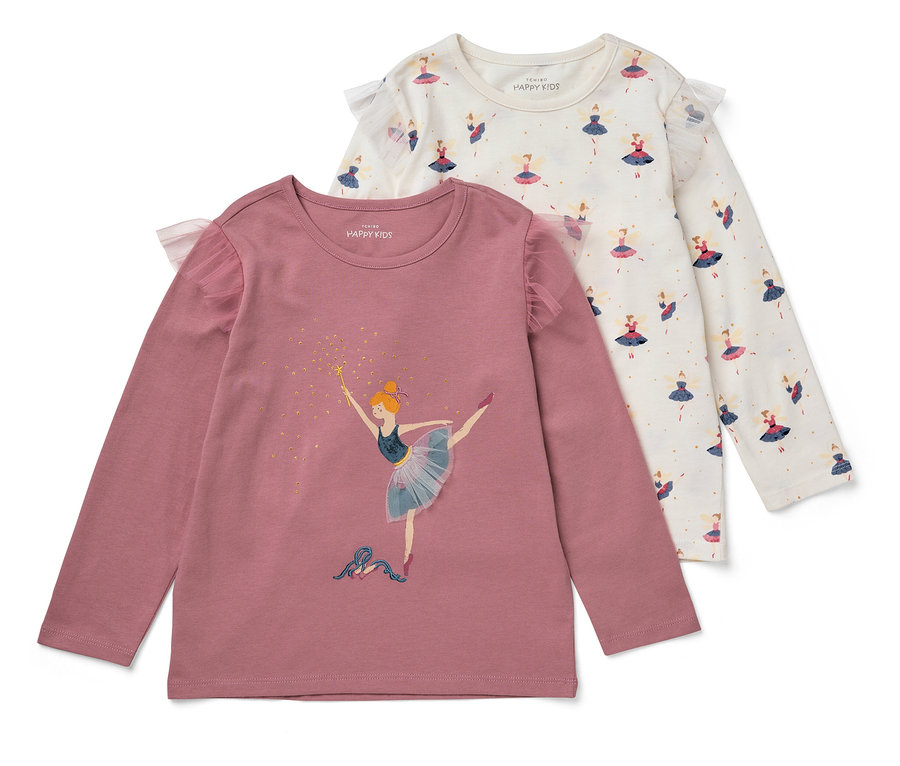 Deux t-shirts à manches longues et ruché en tulle pour enfant sont posés l'un sur l'autre. L'un est rose avec une ballerine, l'autre est blanc avec un motif de fées.