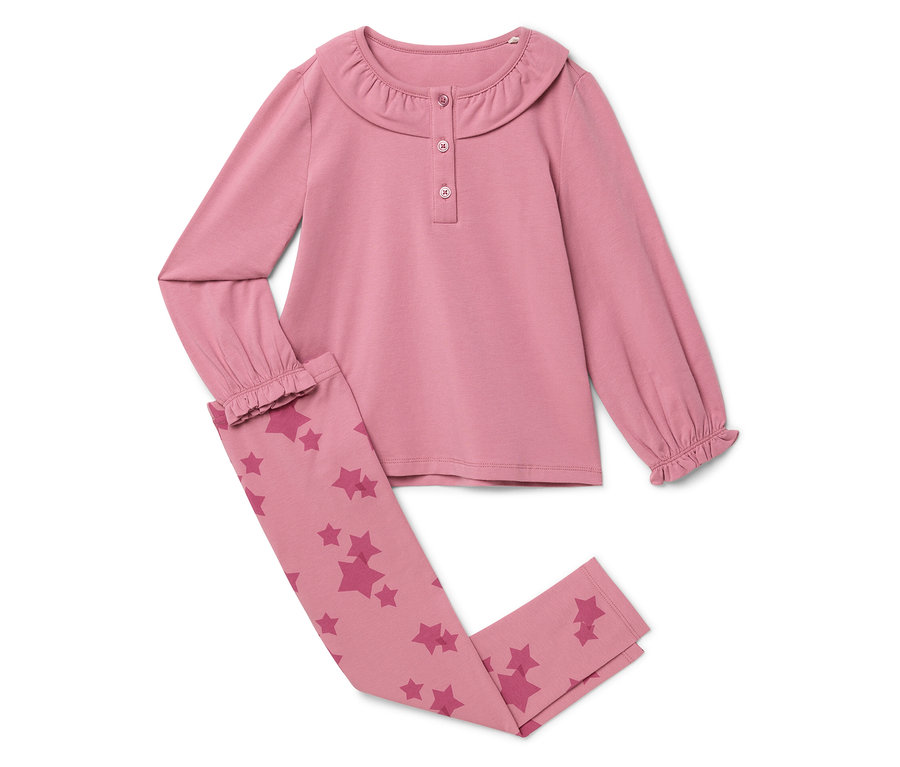 Pyjama rose à manches longues avec un pantalon à motifs étoilés.