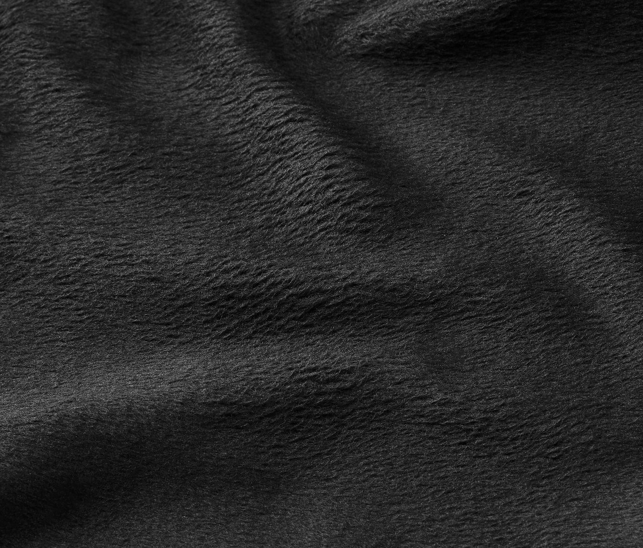Gros plan sur la texture d'un tissu noir.