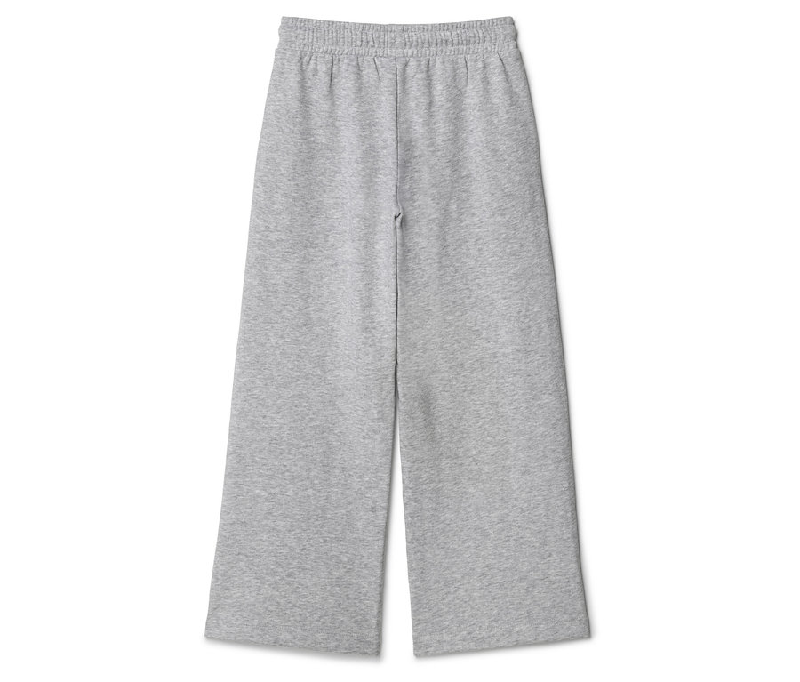 Pantalon de survêtement gris à jambes larges et taille élastique posé sur un fond blanc.
