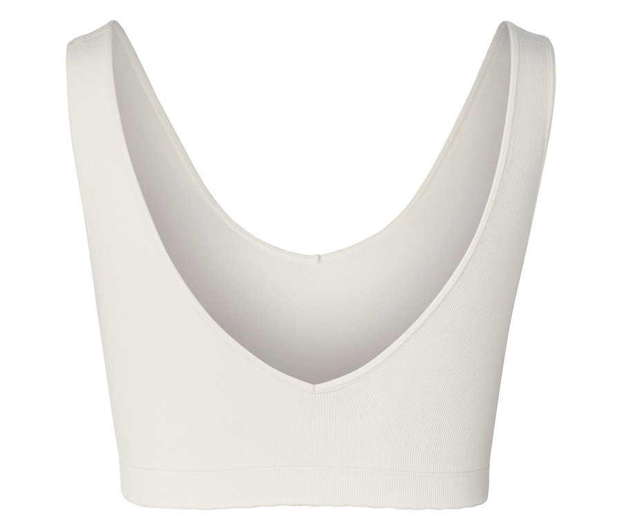Gros plan d'un soutien-gorge de sport blanc avec un décolleté en V.