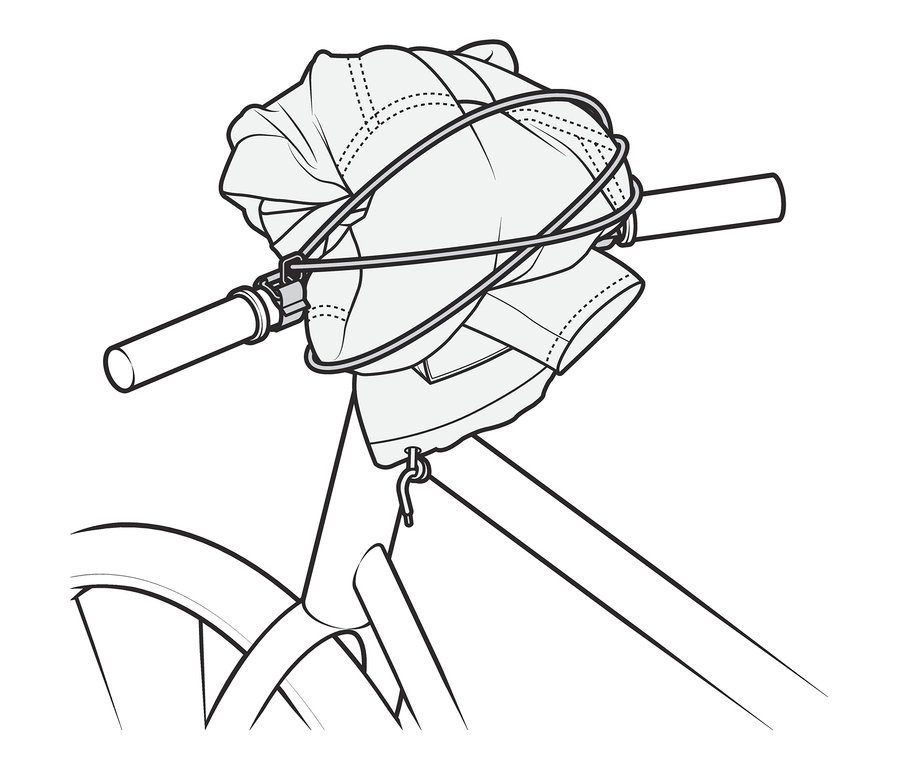 Guidon de vélo avec sangle de fixation sur le guidon maintenant un chargement.