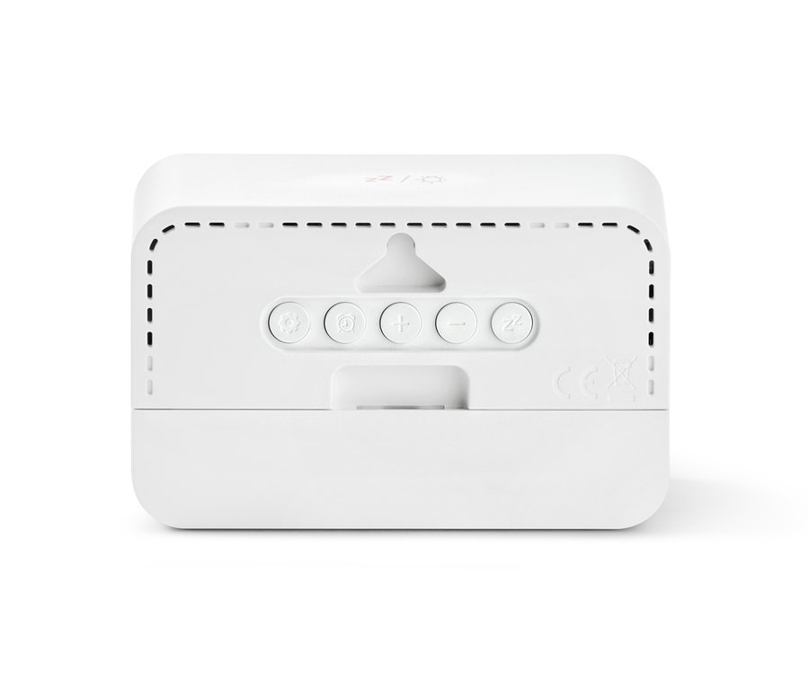 Détail du dos d'un réveil LCD numérique avec boutons de commande.