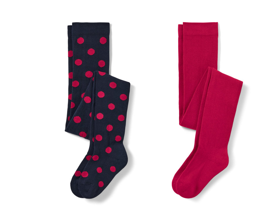 Deux collants pour tout-petits : un bleu marine à pois rouges et un rouge.