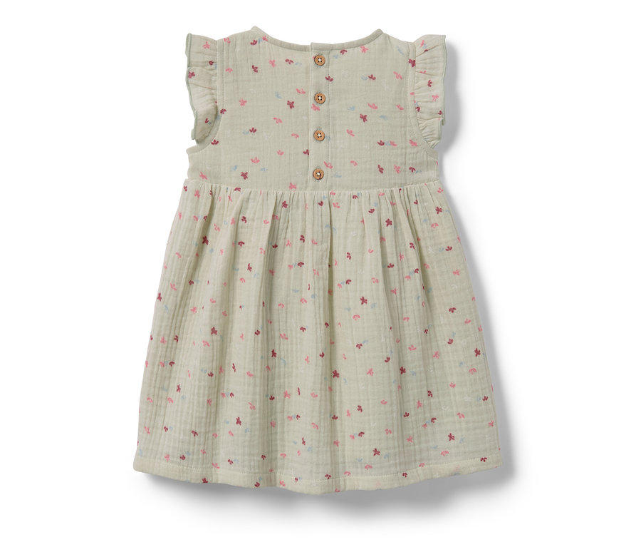 Robe tissée pour bébé avec motif floral.