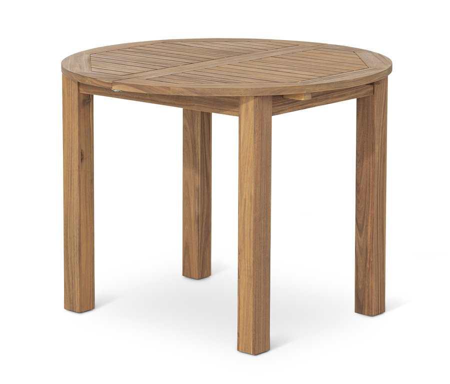 Table ronde extensible en bois massif avec quatre pieds.