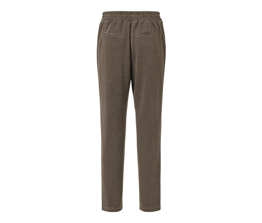 Un pantalon de jogging marron avec jacquard pied-de-poule.