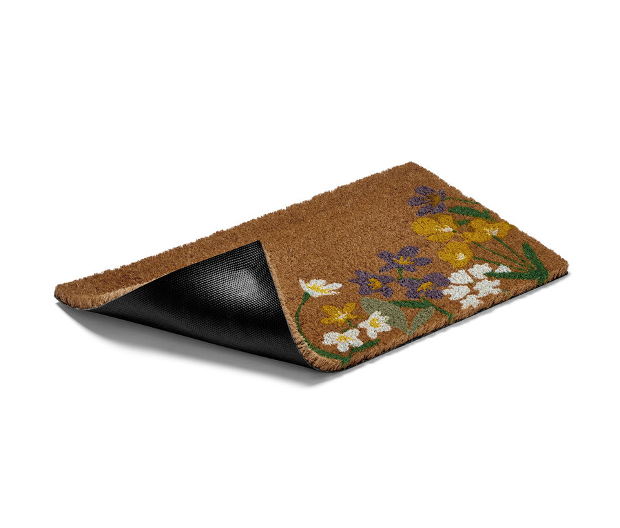 Un paillasson en fibre de noix de coco marron avec un motif floral.