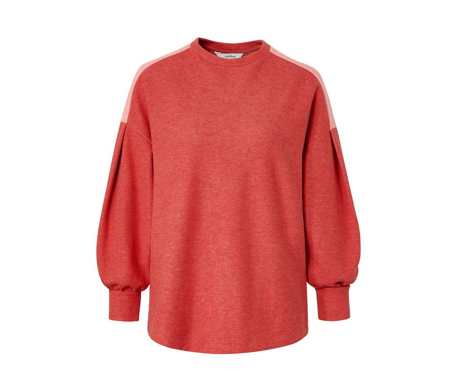 Sweat-shirt rouge à manches longues bouffantes.