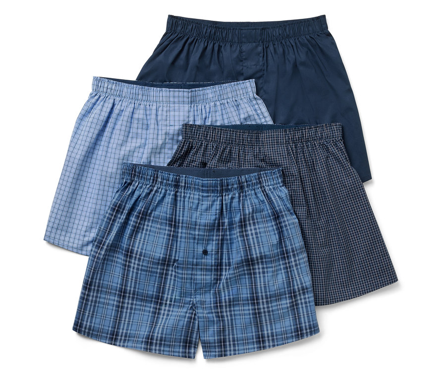 Quatre boxers pour hommes de différentes couleurs et motifs.