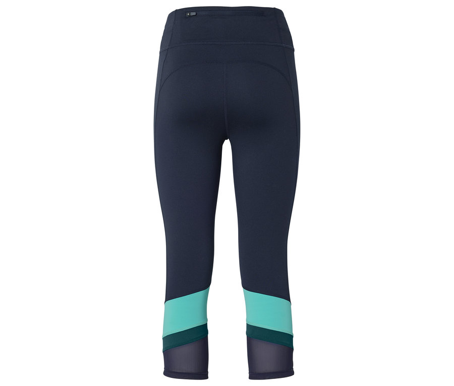 Pantalon de sport Capri bleu foncé avec des accents de couleur turquoise et bleu marine et des empiècements en maille sur le bas des jambes, vu de dos.