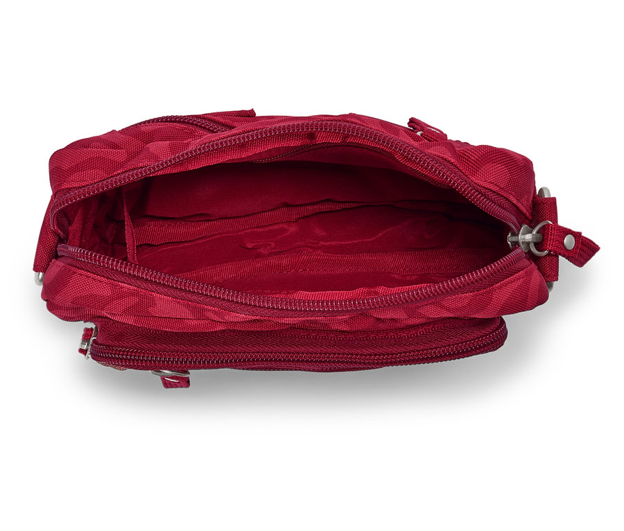 Gros plan d'un sac à main rouge ouvert et vide.