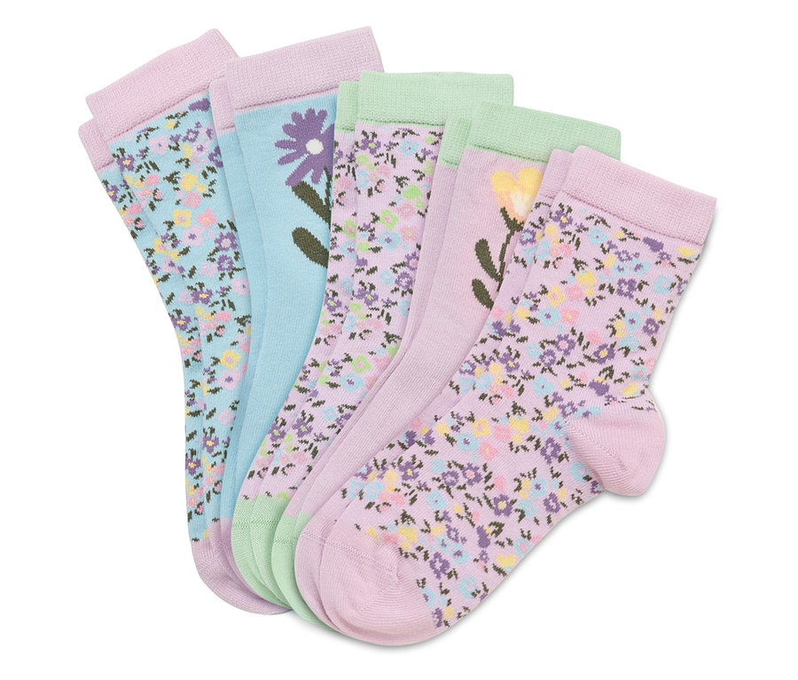 Cinq paires de chaussettes enfant avec des motifs de fleurs.