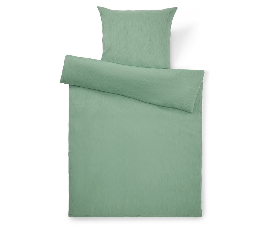 Vue de dessus d'une parure de lit vert clair composée d'une taie d'oreiller, d'une couette et d'une housse.