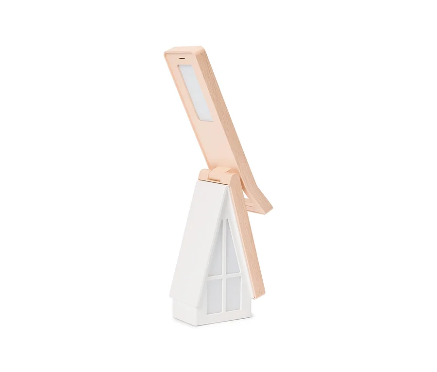 Lampe de table pliable blanche et beige clair avec une base en forme de maison et une tête d'éclairage inclinée.