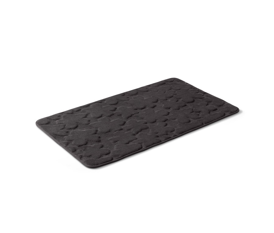 Un tapis de bain confortable noir, d'environ 60 x 100 cm.