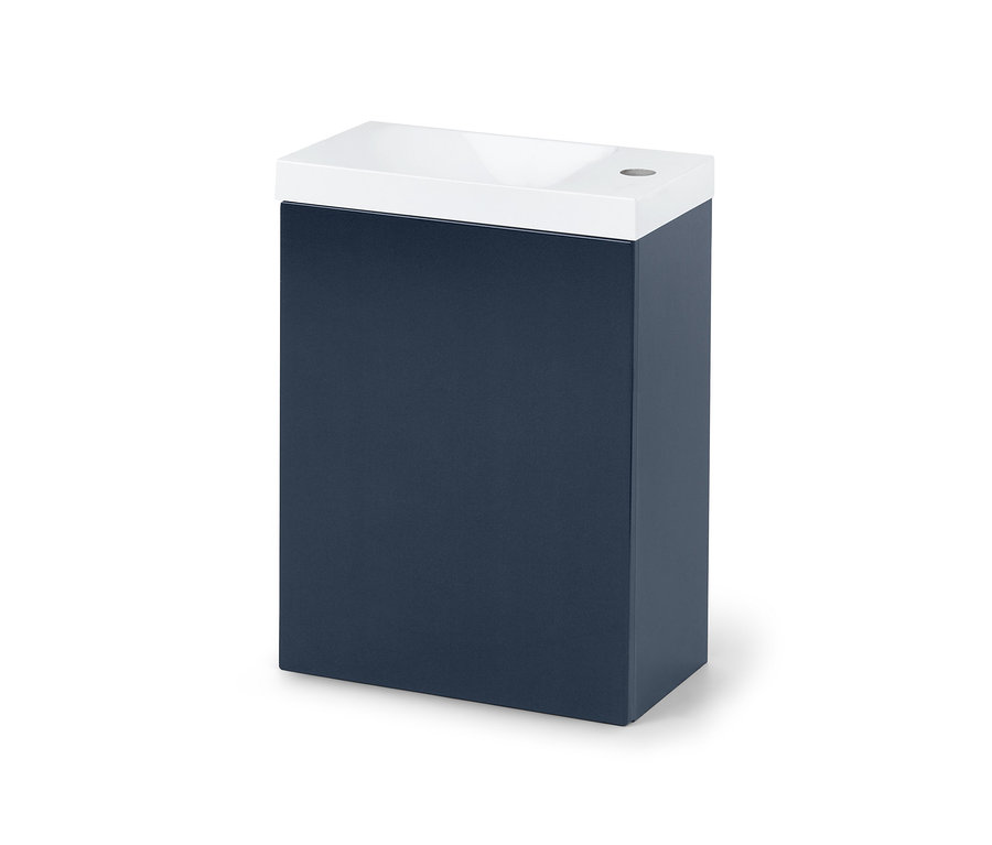 Lavabo bleu pour toilettes invités avec vasque blanche sur le dessus.