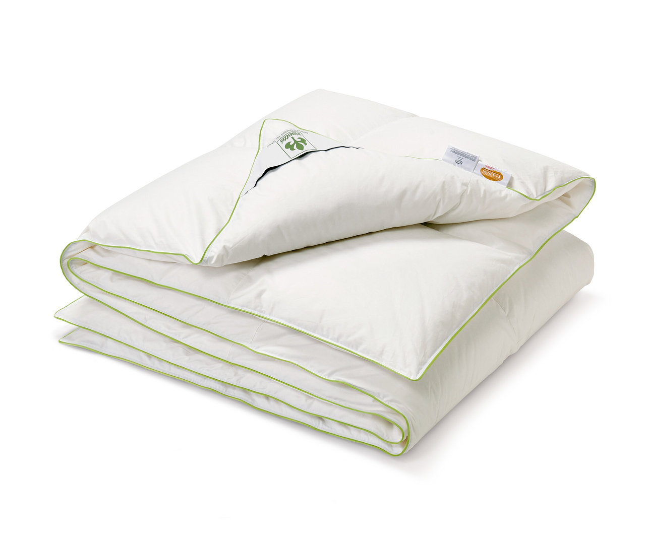 Couette mi-saison blanche irisette® pliée avec bordure vert citron.