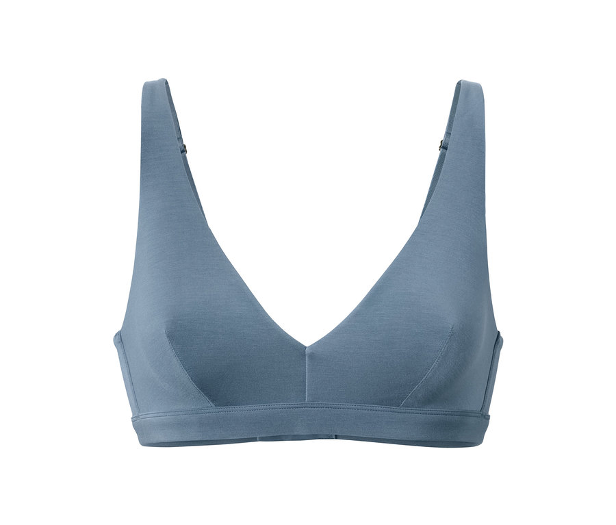 Un soutien-gorge doux bleu sur fond blanc.