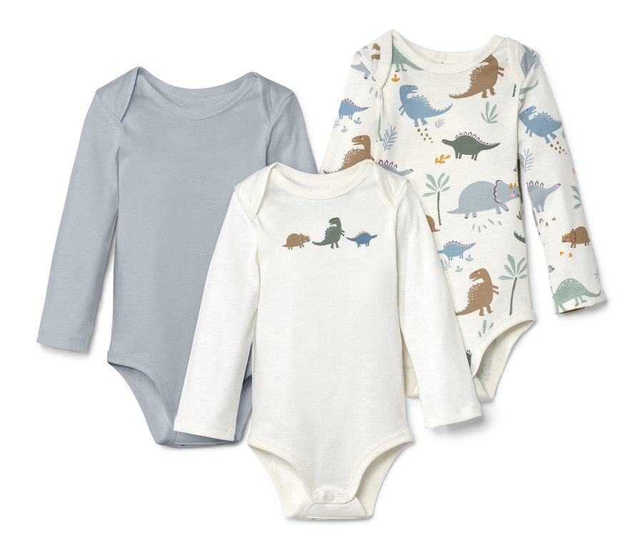 Trois bodies à manches longues : un gris, un blanc avec des dinosaures et un blanc avec un motif de dinosaures.