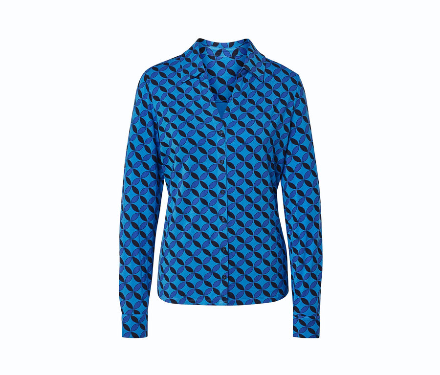 Blouse avec patte de boutonnage à motif géométrique bleu.
