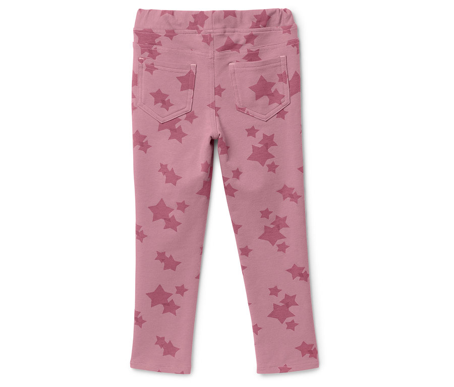 Pantalon rose avec des étoiles à l'arrière.