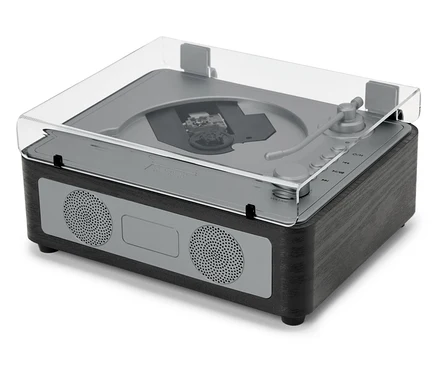 Un haut-parleur CD/Bluetooth® avec un couvercle transparent est posé sur une surface blanche.