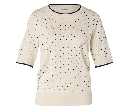 Pull crème à manches courtes avec des pois bleu marine et des bordures bleu marine à l'encolure et aux manches.