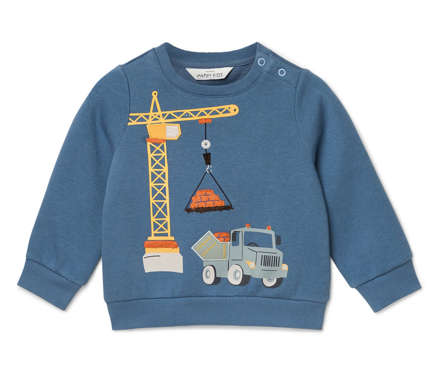 Pull bleu avec une illustration d'une grue soulevant des briques et un camion en dessous.