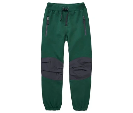 Pantalon de jogging vert avec cordon de serrage gris foncé, deux poches zippées et empiècements gris foncé aux genoux.