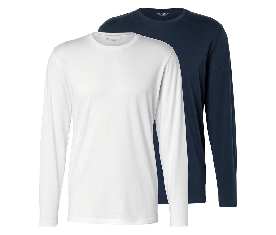 Deux t-shirts à manches longues, un blanc et un bleu marine, sont posés l'un sur l'autre.