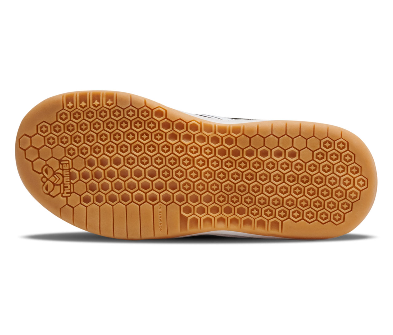 Gros plan sur la semelle d'une chaussure noire Multiplay Flex VC JR hummel® avec motif hexagonal.