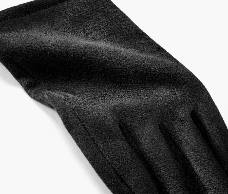 Vue détaillée d'un seul gant noir aspect cuir velours.