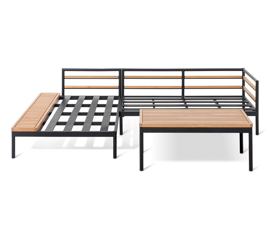 Coin salon Elin avec cadre noir et éléments en bois.