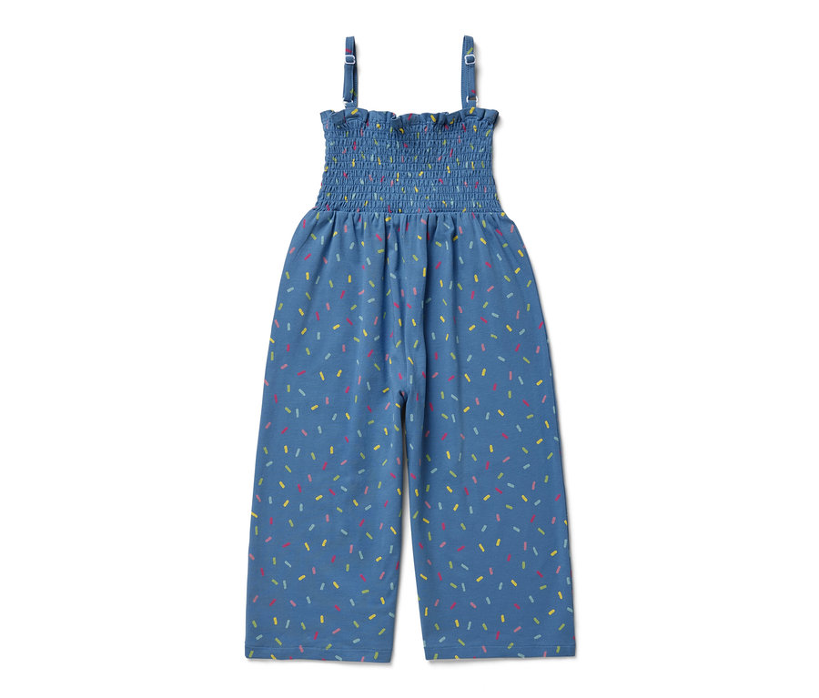 Combinaison bleue de longueur 7/8 avec un imprimé coloré de confettis.