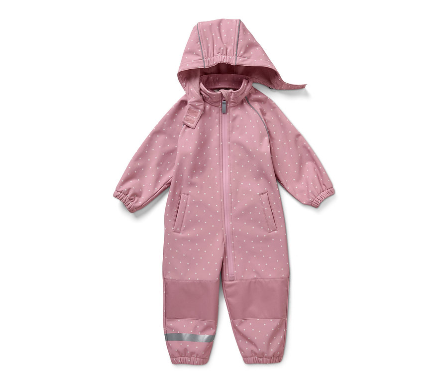 Combinaison en softshell rose à pois blancs pour enfant sur fond blanc.