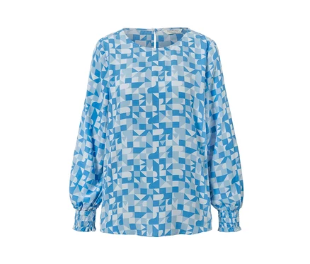Chemisier imprimé bleu avec un motif géométrique.