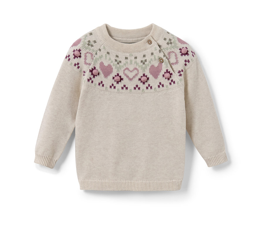 Un pull en maille pour enfant avec un motif norvégien de cœurs et de fleurs.